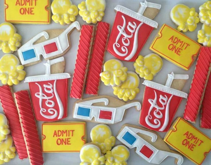 decorated cookies with popcorn and soda on them