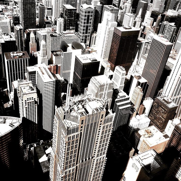 black and white photograph of city buildings in new york, united states taken from the air