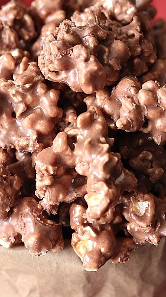 a pile of chocolate covered cookies sitting on top of a table