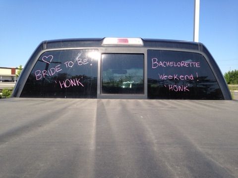 the back window of a truck with writing on it