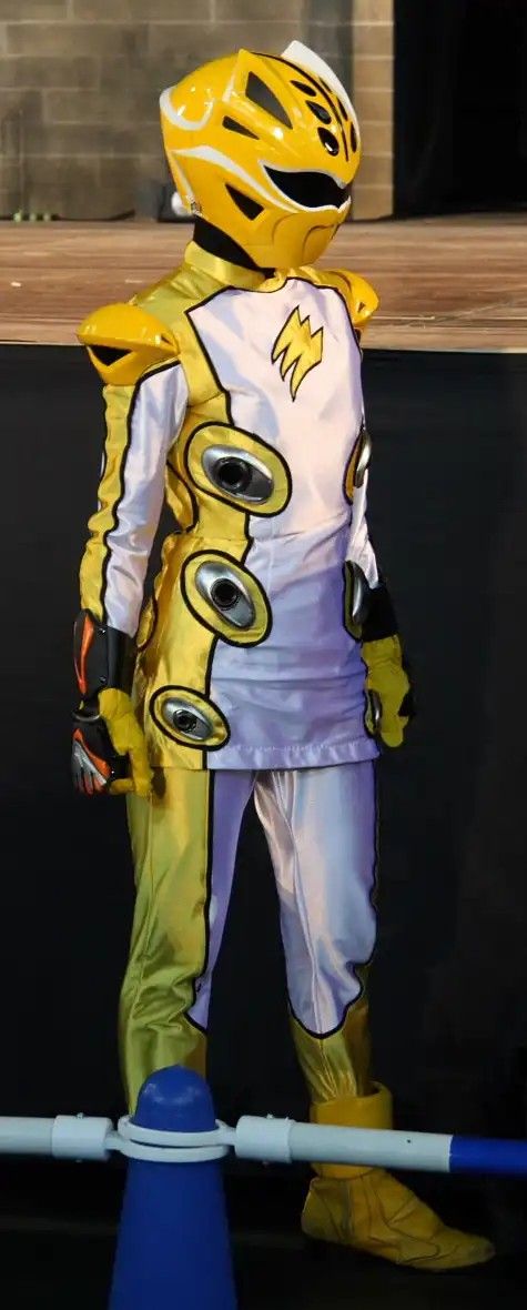 a person in a yellow and white costume