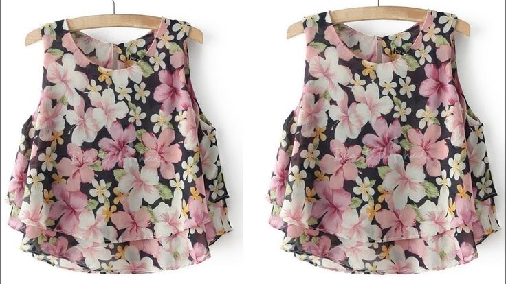 two tops with flowers on them hanging from clothes hangers, one in pink and the other in black