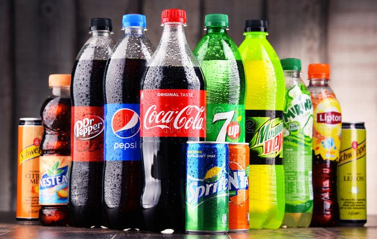 many different types of soda bottles lined up