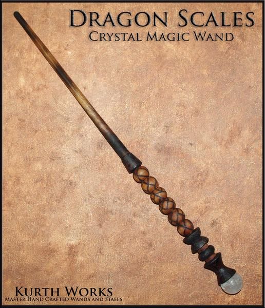 the dragon scales crystal magic wand is made from wood and has a wooden handle with beads on it