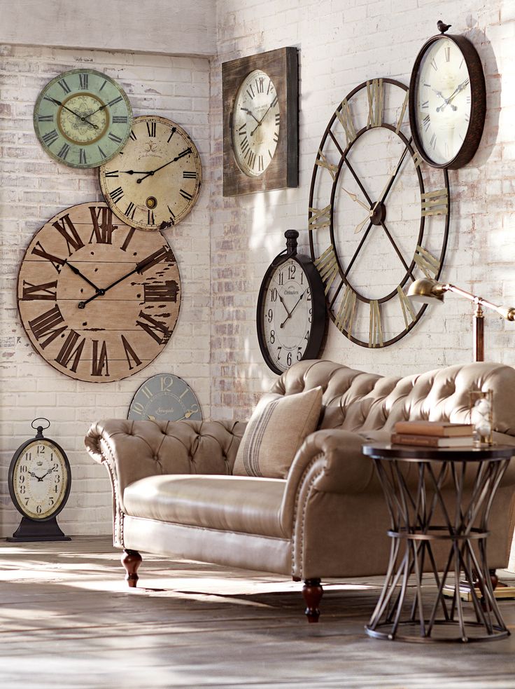 a living room filled with lots of clocks on the wall