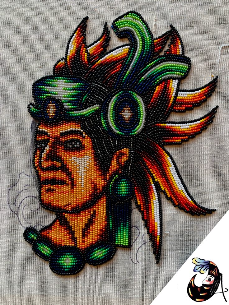 a close up of a person wearing a headdress on top of a piece of cloth