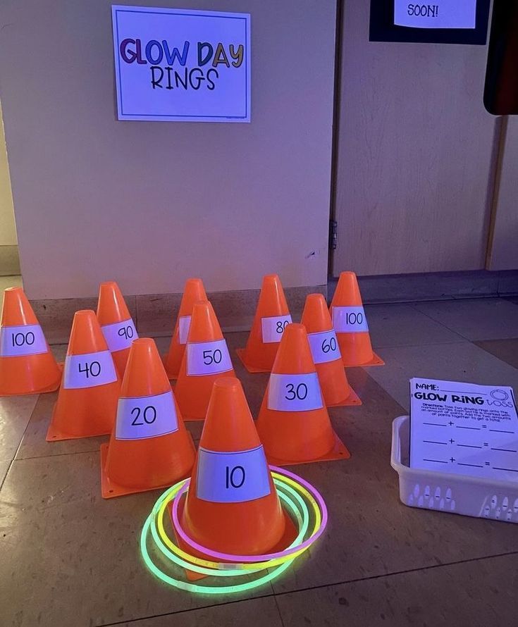 a group of orange cones sitting on top of a floor