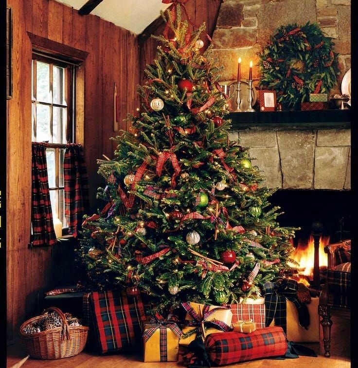 a decorated christmas tree with presents under it