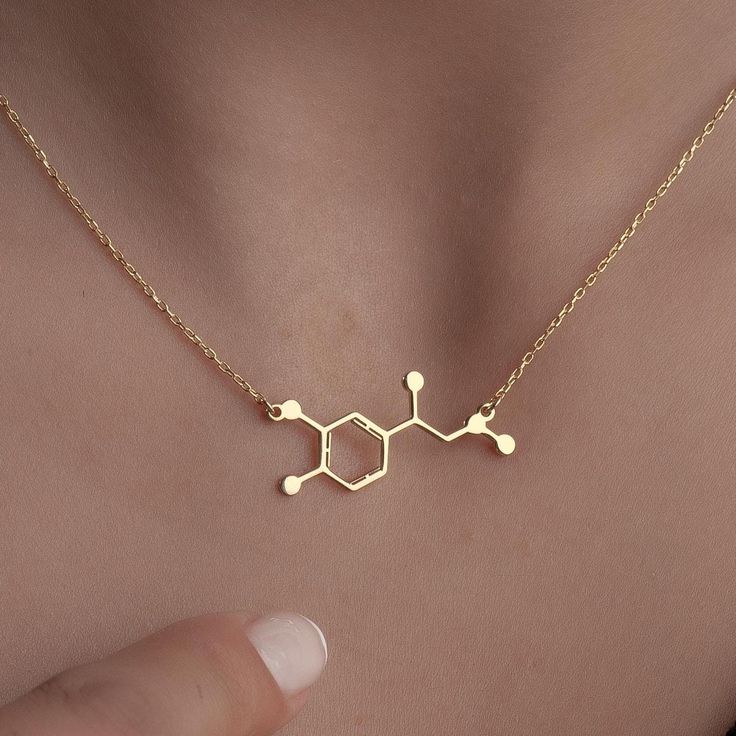 Molecule Chemical Structure Necklace Discover The Perfect Blend Of Science And Style With Our Molecule Chemical Structure Necklace. This Exquisite Piece Features The İntricate Design Of The Dopamine And Adrenaline Molecules, Making İt A Unique Addition To Any Jewelry Collection. Whether You'Re Seeking Motivation Or Simply Want To Celebrate The Wonders Of Science, This Necklace Serves As A Stunning Reminder Of The Joy And Excitement That These Essential Neurotransmitters Bring To Our Lives. Handmade With Care, İt'S An İdeal Gift For Anniversaries, Birthdays, Or Even A Thoughtful Halloween Surprise. Crafted From High-Quality Materials, This Molecular Jewelry Piece İs Not Just A Fashion Statement But A Conversation Starter. Wear İt To İnspire Others Or Give İt To Someone Special Who Shares Yo Adrenaline Molecule, Molecule Necklace, Science Jewelry, Chemical Structure, Silver Gifts, Gifts Christmas, Halloween Gifts, Someone Special, Favorite Jewelry