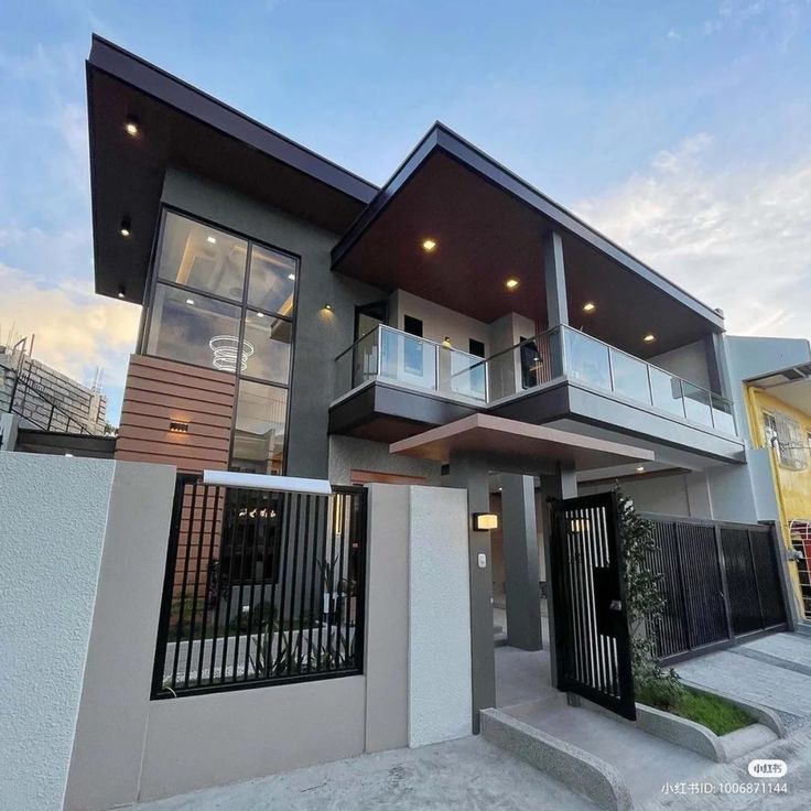 a modern house with two levels and balconies