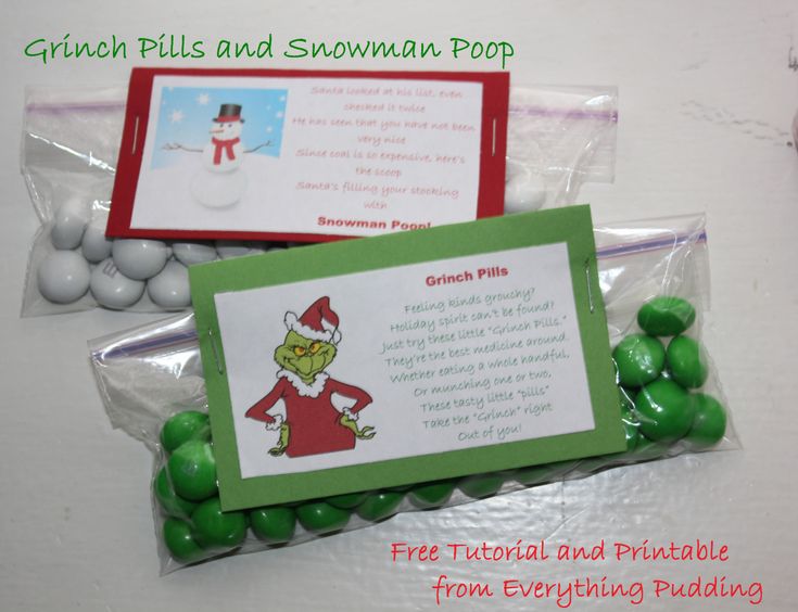 two candy bags filled with green candies next to a snowman pop card and envelope