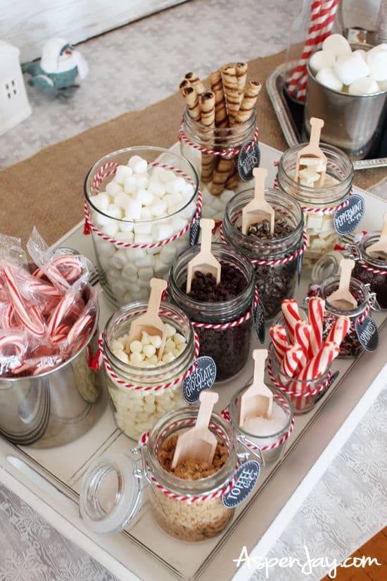 a tray filled with lots of candy and marshmallows on top of a table