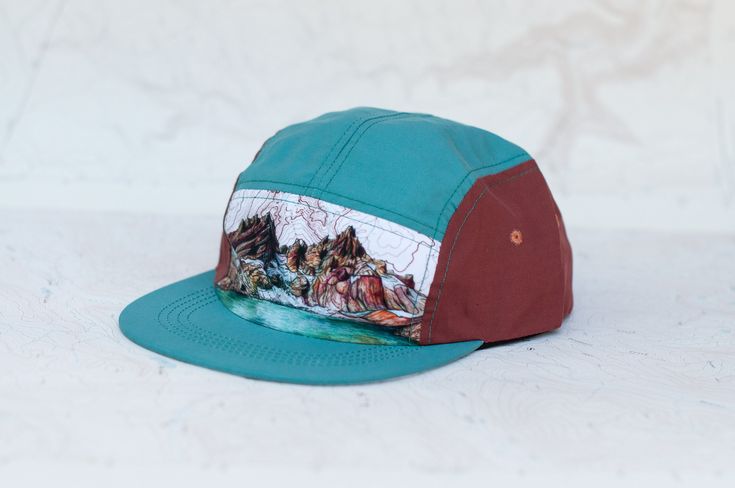 These flat brimmed 5 panel hats feature my artwork on lightweight polyester fabric, recycled plastic visor, and adjustable strap.   Environmentally sustainably and ethically made in Nepal in partnership with a World Fair Trade Organization Guaranteed Member with a mission to create jobs that empower marginalized people to fresh starts and fulfilled lives. See shop for other hat options. Sporty Six-panel Hat For Hiking, Lightweight Six-panel Hat For Hiking, Lightweight Six-panel Hiking Hat, Adjustable Six-panel Trucker Hat For Hiking, Nylon 5-panel Hiking Hat, 5 Panel Hat, Outdoor Hiking, Quick Dry, Trucker Cap