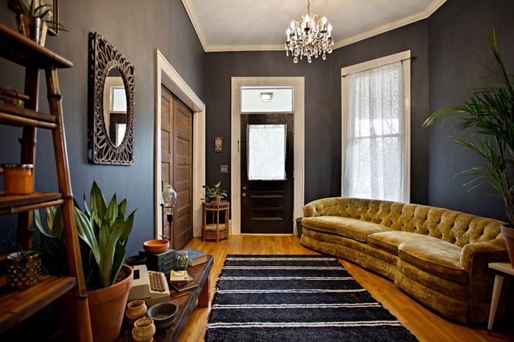 a living room filled with furniture and a chandelier