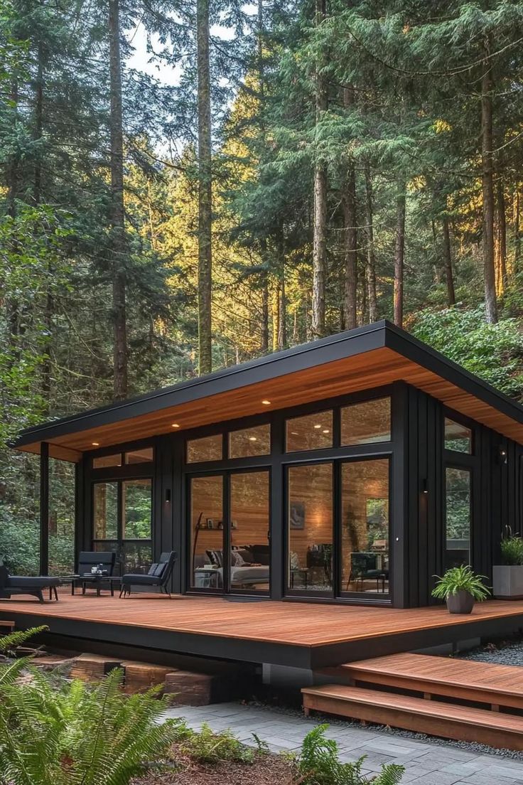 a small house in the middle of a forest with lots of trees and stairs leading up to it