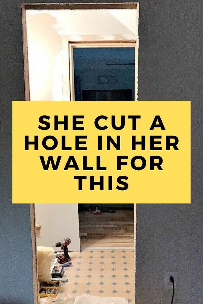 there is a yellow sign that says she cut a hole in her wall for this