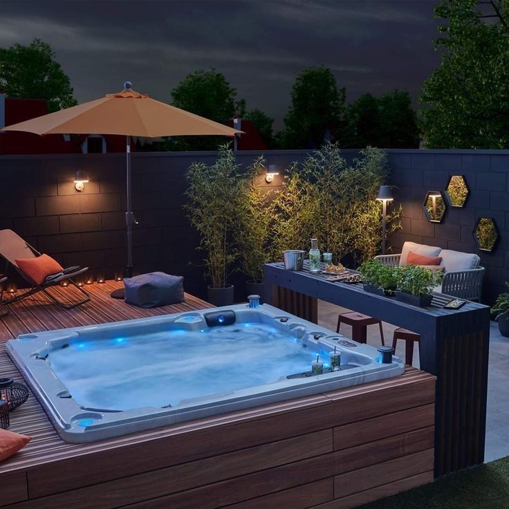 a hot tub sitting on top of a wooden deck