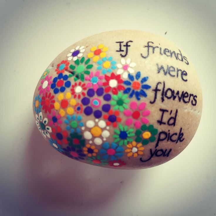 a rock with flowers painted on it and words written on the rocks that say if friends were flowers i'd pick you