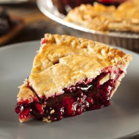 a piece of pie sitting on top of a white plate