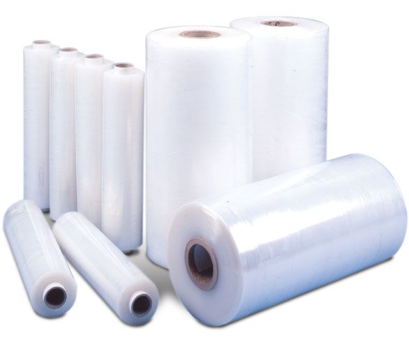 several rolls of clear plastic wrap on white background