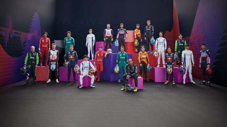 a group of people standing next to each other in front of colorful luggage bags and suitcases