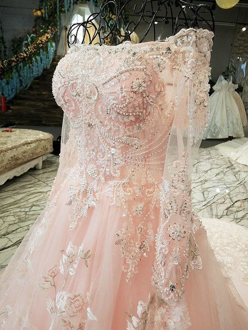 a pink dress on display in a store