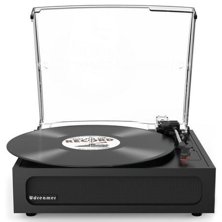 an old record player sitting on top of a black box with clear cover and red knobs