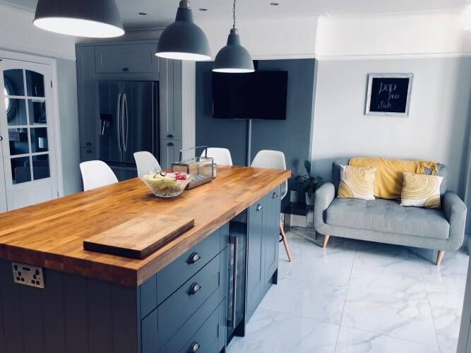 a large kitchen island in the middle of a living room