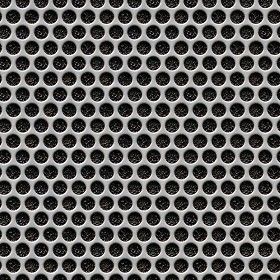 a metal grate with holes in the middle and black dots on it's surface