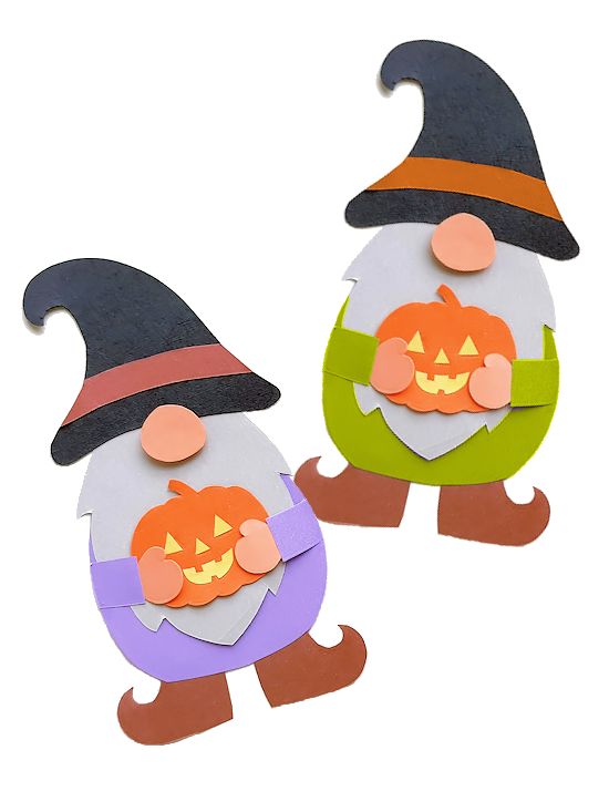 two paper cut outs with pumpkins and witches on them, one is wearing a witch's hat