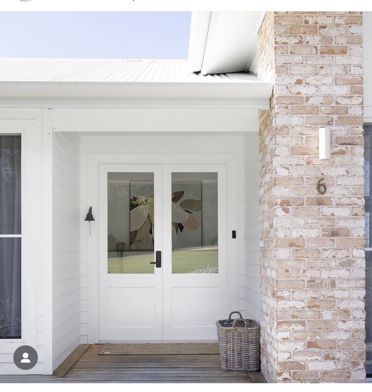 a white front door with two glass panels