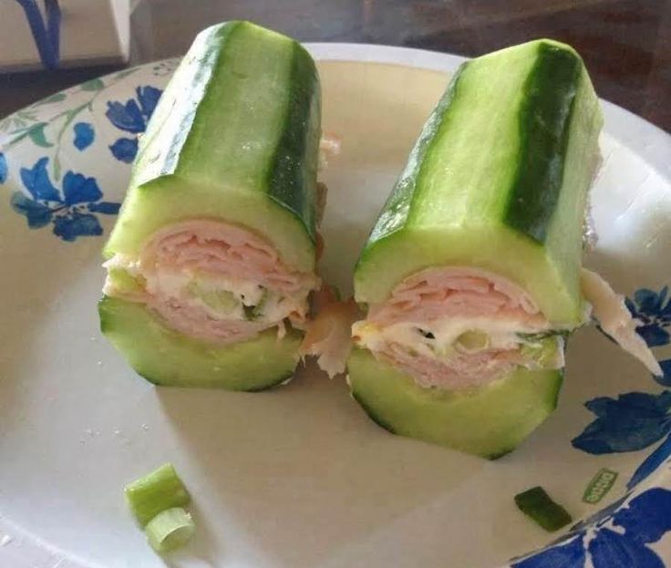 two cucumbers cut in half on a plate