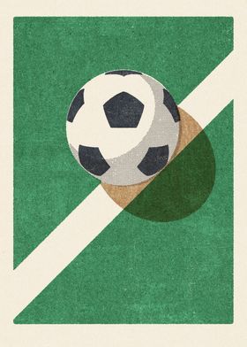 a soccer ball sitting on top of a green field next to a white and black line