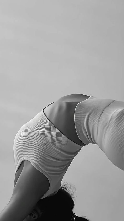 black and white photograph of a woman doing yoga