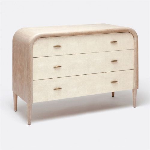 a white dresser with three drawers on it