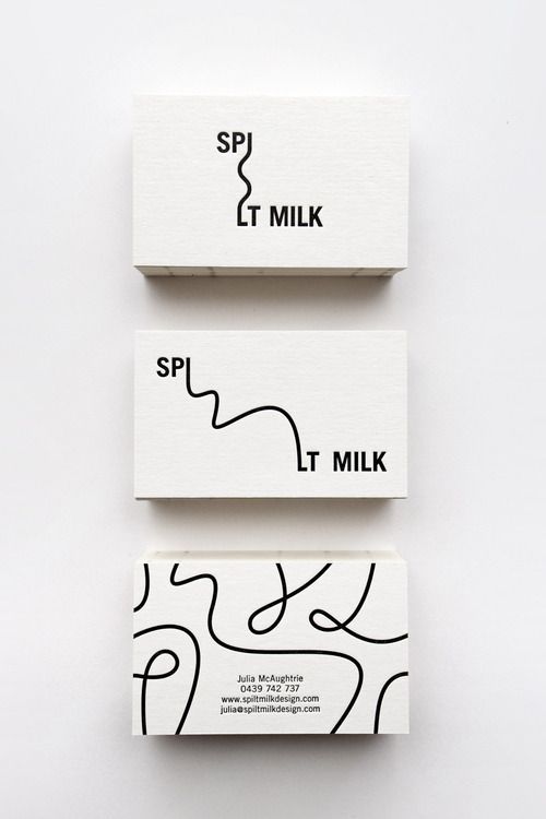 three business cards with black and white lines on the front, one for spjt milk