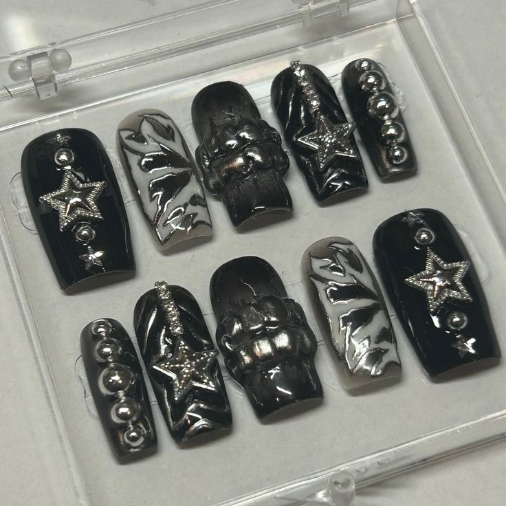 This ATE inspired set screams "STRAY KIDS" With their new album dropping soon, the digital cover was the ultimate inspiration for these nails. Adorned with metallic stars, silver pearls, and 3D grills, this set is as extra as they come. These nails are perfect for a concert or for everyday wear if you're a SKZ connoisseur on the daily!  Available in shape Medium Square.  This set includes 10 nails fit to your personal sizes in the exact design pictured. Follow instructions listed in personalization for accurate sizes as refunds for incorrect sizes are not permitted.  Included in this purchase is: - Acrylic Display Case - 10 Nails in desired design - Application kit - Stickers and Thank Yous Chrome Y2k Nails + Charms, Stray Kids Inspired Nails Ate, Ate Nails Skz, Straykids Ate Nails, Star Inspired Nails, Stray Kids Nails Inspired, Skz Nails Design, Star Charm Nails, Skz Inspired Nails