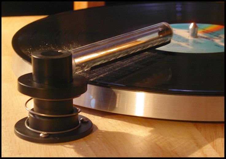 a turntable with a record player on top of it