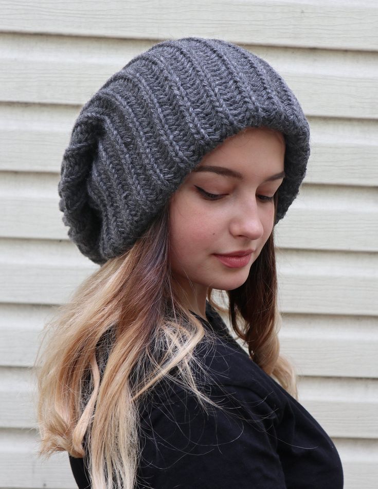 Slouchy winter hat PLEASE PAY ATTENTION - THE HAT IS EXTRA LARGE, EXTRA SLOUCHY, EXTRA THICK, AND EXTRA LONG Extra large knitted slouchy beanie is super stylish and warm. It is knitted using very thick yarn and it has 2 layers to keep your head warm and cozy on even the coldest winter days! The hat is very expandable and you can easily fold it to look different. This baggy hat will nicely suit to both men and women. Material 70% - acryl 30% - wool Ready for shipping in 1-2 business days. One Size Gray Crochet Hat For Fall, Casual Gray Winter Beret, Warm Slouchy Beanie Bonnet, Gray Brimmed Crochet Hat For Winter, Slouchy Casual Beret For Winter, Slouchy Beanie Bonnet For Winter, Winter Slouchy Bonnet Beanie, Slouchy Winter Beanie Bonnet, Slouchy Winter Bonnet For Cold Weather