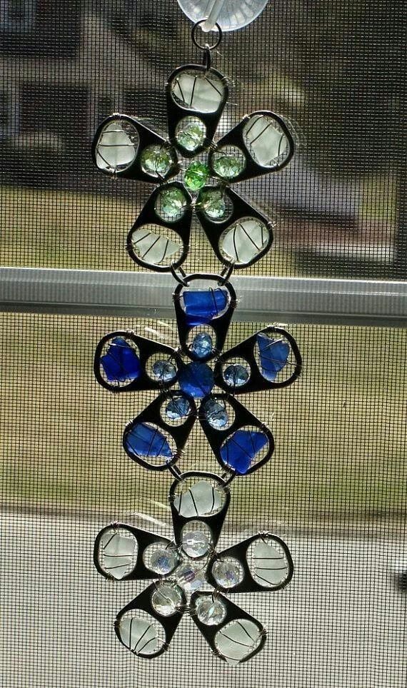 a stained glass sun catcher hanging from a window