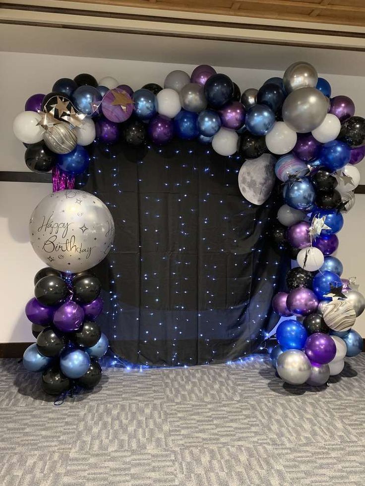 an arch made out of balloons and stars