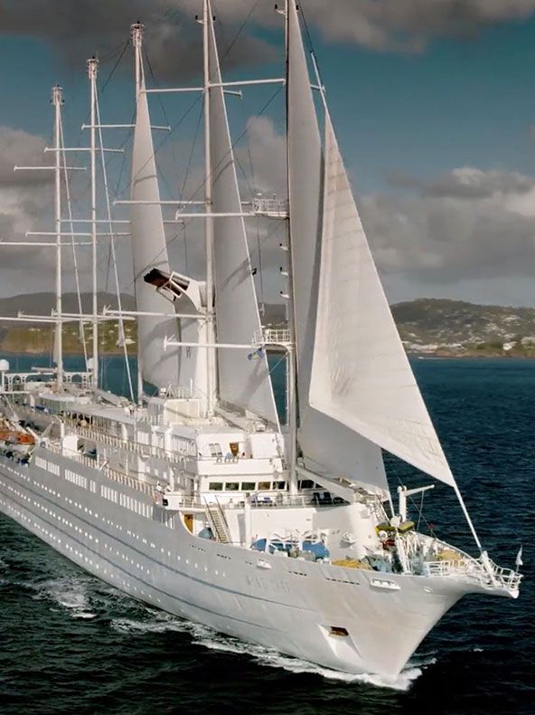 a large white boat sailing in the ocean