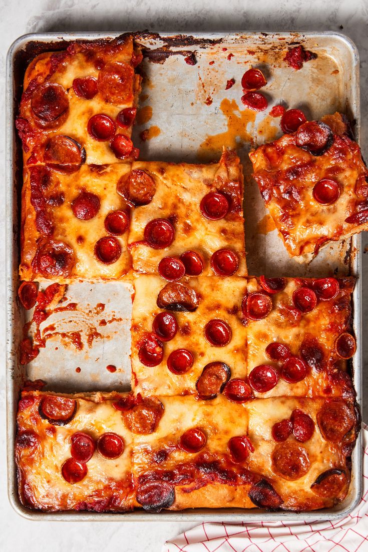 a pizza with pepperoni and cheese in a pan