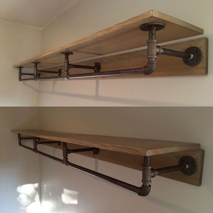 two wooden shelves with metal brackets on them