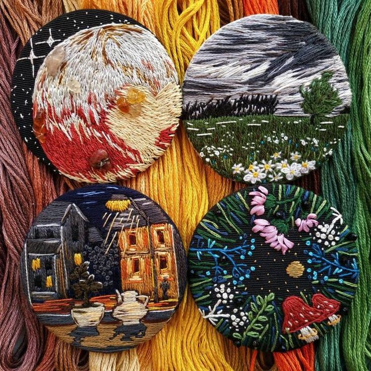 four different colored yarns are arranged on the same surface, each with an image of a house