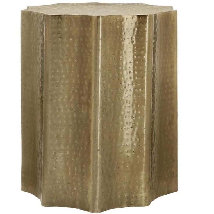 a gold colored side table that is made out of metal