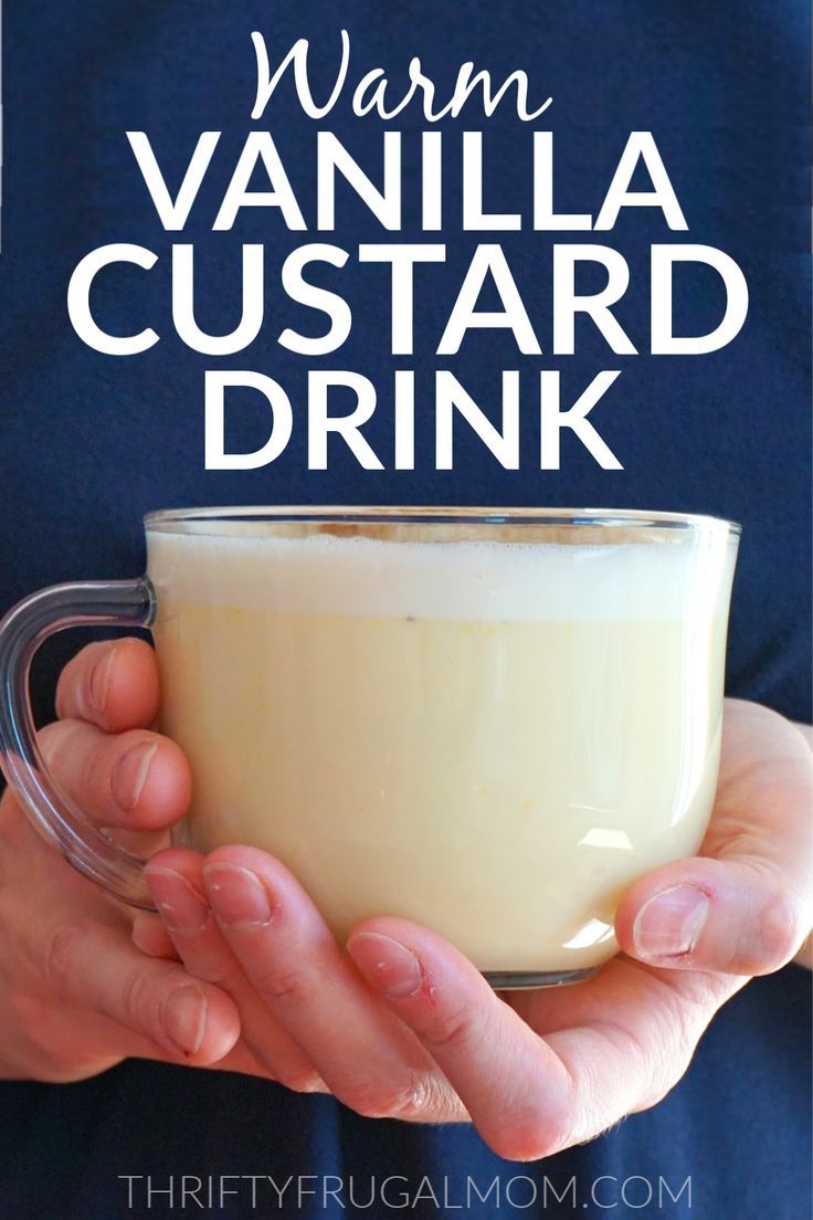 a person holding a glass mug with vanilla custard in it and text overlay that reads warm vanilla custard drink