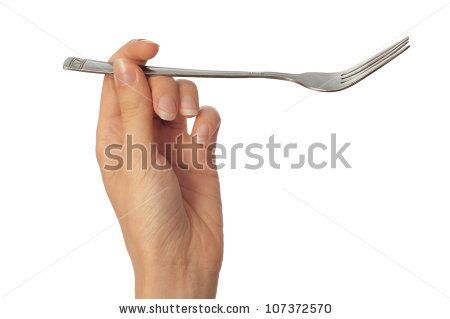 a woman's hand holding a fork on a white background