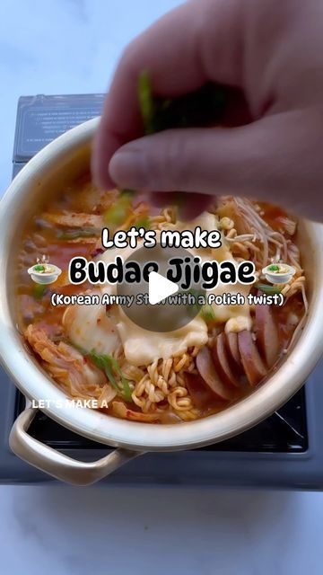 a person is dipping some food into a bowl