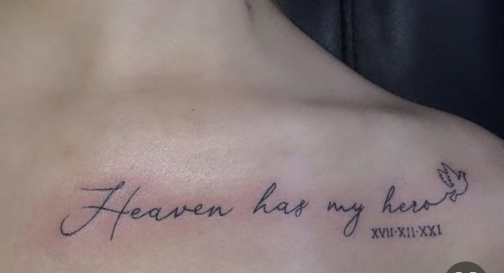 a woman's chest with the words heaven has my heart tattooed on her left shoulder